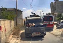 Joven palestino atado a jeep militar en Israel