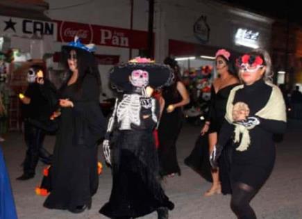 Realizan desfile de catrinas y catrines