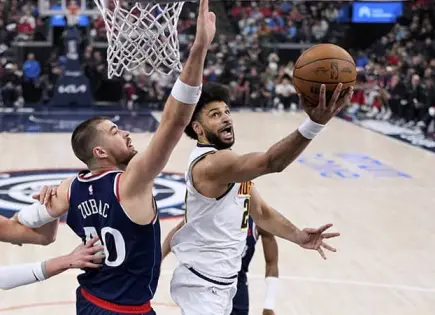Nuggets ganan con enceste de Gordon