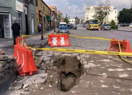 Fotos | Reportan más socavones tras lluvias en la capital