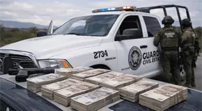 Sorprenden a dos con 2.4 millones en efectivo en la 57